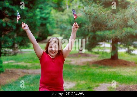 Independence Day. An American flag waving in the wind. Close-up Stock Photo - Alamy