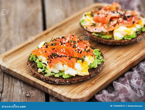 Smoked Salmon, Scrambled Eggs and Avocado Rye Crisp Toast Stock Photo ...