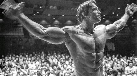 Arnold Schwarzenegger posing in the Mr. Olympia competition (1974 ...