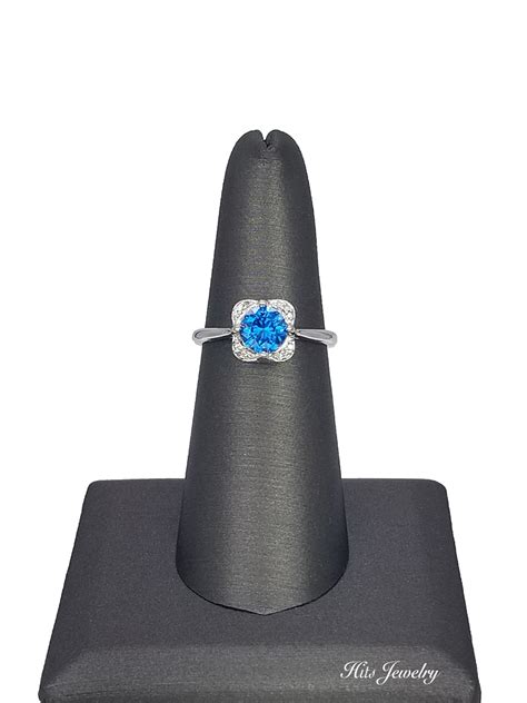 Blue Diamond Solitaire Surrounded By Brilliant White Diamonds | 18k ...