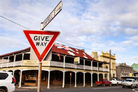 Image of Give way street sign at intersection of side road with main ...