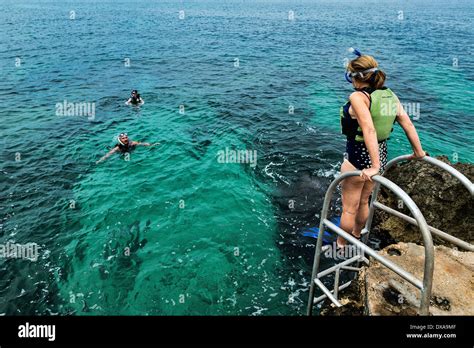 Snorkeling in the tropical aqua waters of Negril, Jamaica Stock Photo ...