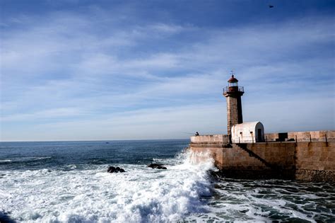 Lighthouse near Porto, Portugal - | Lighthouse, Beautiful lighthouse, Beautiful landscapes