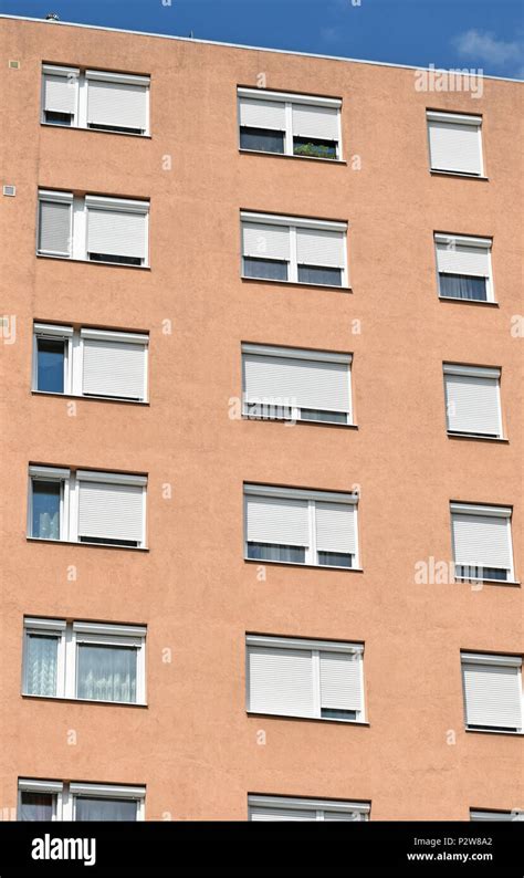 Windows of an apartment building Stock Photo - Alamy