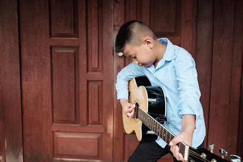 Boy Playing Guitar Stock Photos, Images and Backgrounds for Free Download