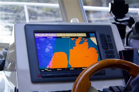 A close-up of a boat's GPS navigation system displaying a map.