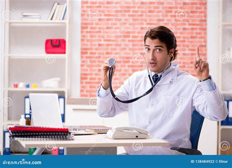 The Young Doctor Working in Hospital Stock Photo - Image of listening, diagnosis: 138484922