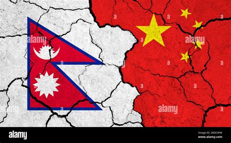 Flags of Nepal and China on cracked surface - politics, relationship ...