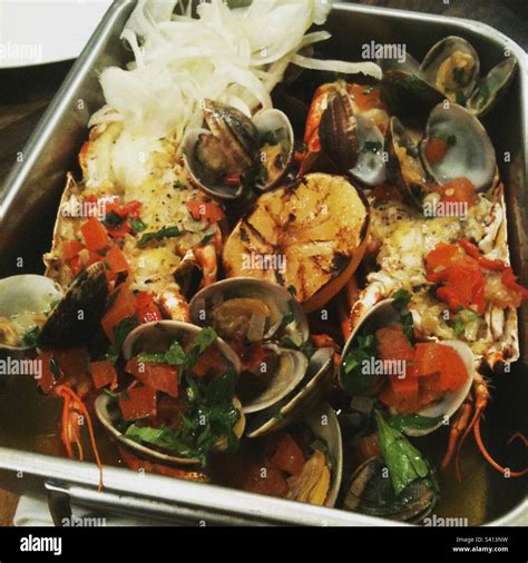 Oven baked seafood Stock Photo - Alamy