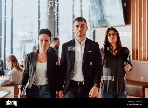 Group of successful business people standing together at office Stock Photo - Alamy