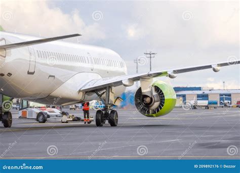 The Plane Pushes the Tow Tractor before Starting the Engines and Taxiing, Rear View Stock Photo ...