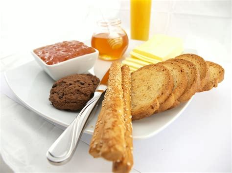 Premium Photo | A plate of bread and butter with a fork on it