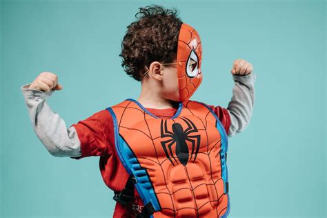 A Boy in Red and Black Spider Man Costume · Free Stock Photo