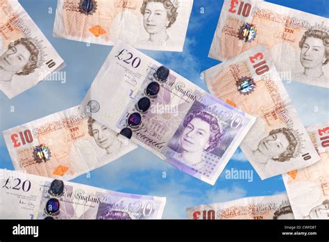 Pound sterling money notes falling from the sky Stock Photo - Alamy