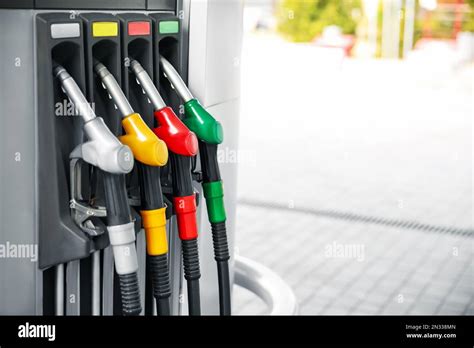 Fuel pump nozzles at modern gas station Stock Photo - Alamy