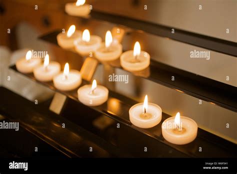 Candles lighting in Catholic church Stock Photo - Alamy