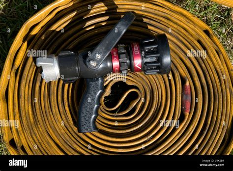 fire hose and variable spray nozzle Stock Photo - Alamy