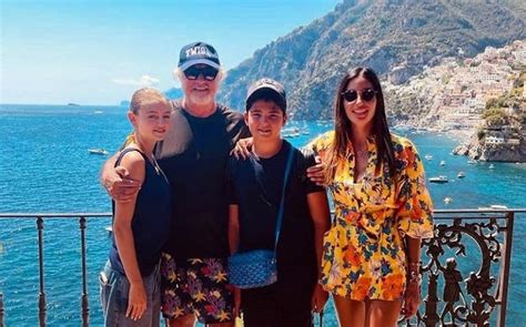 Flavio Briatore strikes a pose beside his children