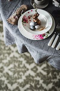 Royalty-Free photo: Round dinner table decorated with easter motifs | PickPik