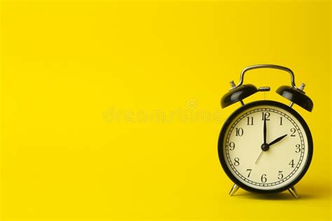 Time Background Concept. Vintage Classic Alarm Clock on Yellow Empty Background Stock Image ...