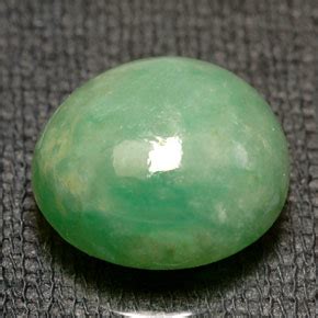 Oval Cabochon Green Jadeite with White Mottles - Gemstone Image