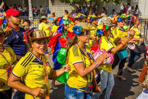 Performers with colorful and elaborate costumes participate in ...