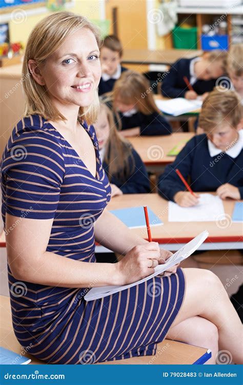 Portrait of Teacher in Class with Pupils Stock Image - Image of looking ...