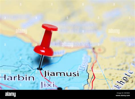 Jiamusi pinned on a map of China Stock Photo - Alamy