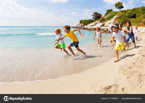 Group Happy Kids Racing Barefoot Having Fun Sandy Beach Sunny Stock ...