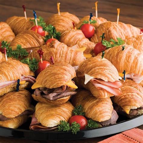 Snack-Lits: Mini croissant rolls are filled with smoked turkey breast, honey ham, roast beef and ...