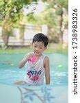 asian cute boy splashing on summer pool image - Free stock photo - Public Domain photo - CC0 Images