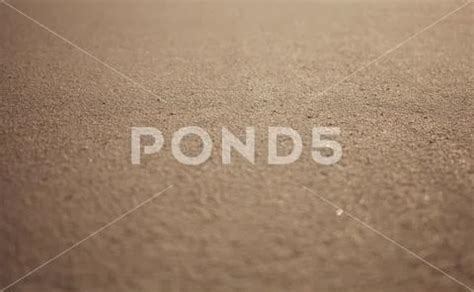 Photograph: Sand texture. Sandy surface for background. #135413482