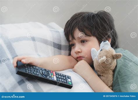 Dramatic Portrait Lonely Kid Sad Face Holding Remote Control Sitting on Couch,child Sitting on ...