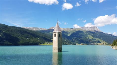 The bell tower at (in) Reschensee, South Tyrol, Italy. 08/2019. : r/hiking