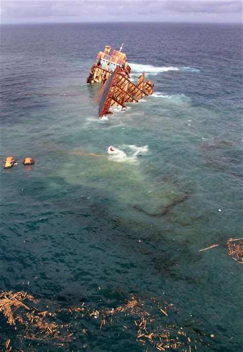 A cargo ship sinking off the coast of New Zealand after running aground onto a reef : r ...