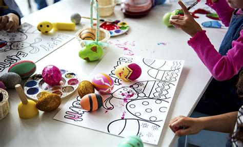 Kids painting easter eggs and | Premium Photo - rawpixel