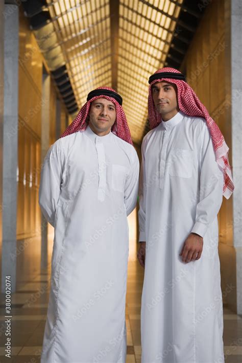 Middle Eastern men in traditional clothing in corridor Stock Photo ...