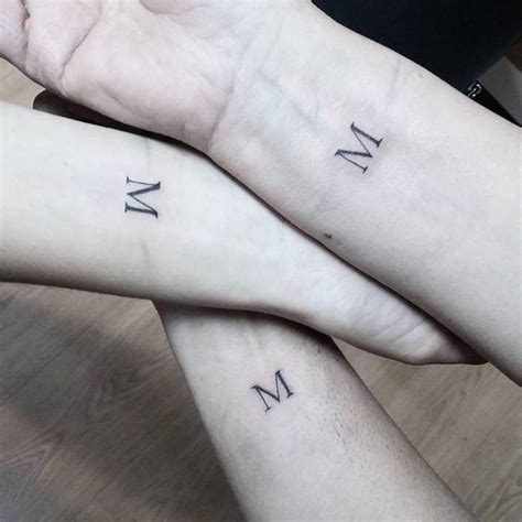 Matching letter M tattoos - Tattoogrid.net