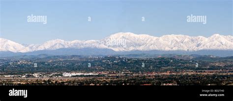 City of Tustin with rare snow capped San Bernardino mountain on the ...