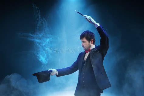 Magician or Illusionist is Showing Magic Trick. Blue Stage Light in ...