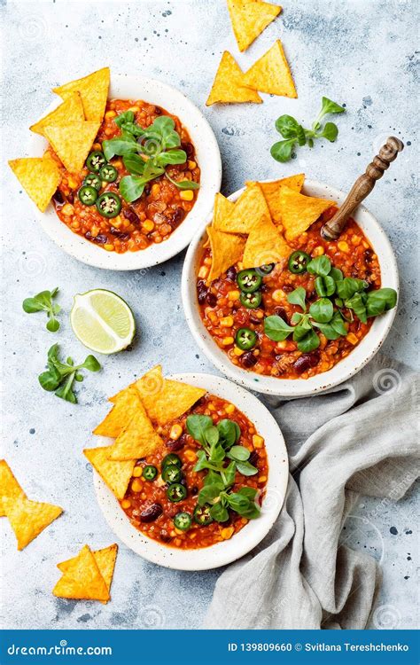 Vegetarian Chili Con Carne with Lentils, Beans, Nachos, Lime, Jalapeno. Mexican Traditional Dish ...