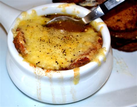 French Onion Soup with Brandy, Gruyere Cheese & Crispy Croutons - A Hint of Wine