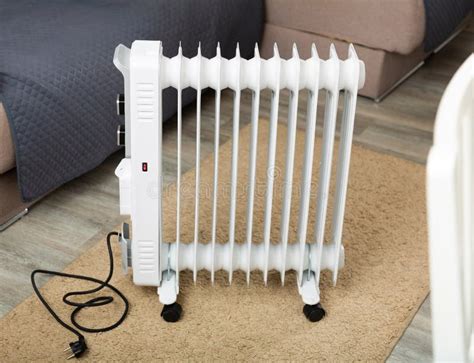 Electric Oil Heater on Floor in Room Stock Photo - Image of saving ...