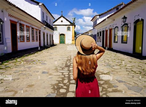 Visiting colonial architecture in Latin America. Back view of young ...