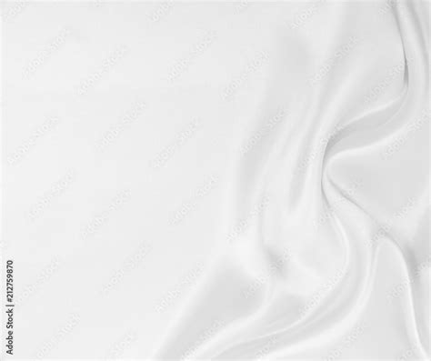 Smooth elegant white silk or satin luxury cloth texture as wedding background. Luxurious ...