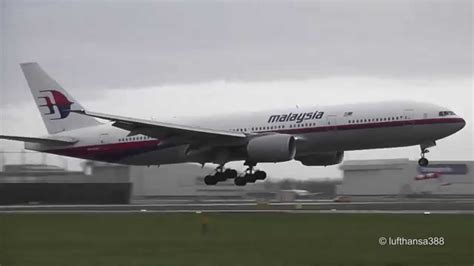 Malaysia Airlines B777-200ER landing and takeoff at Amsterdam Schiphol ...