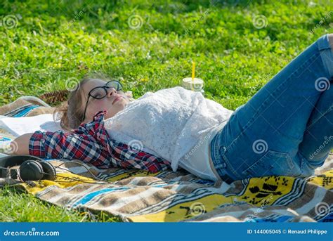 Young Teenager Girl Lying in the Grass Stock Image - Image of field, student: 144005045