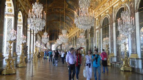 The Hall of Mirrors at Versailles--no room full of mirrors, chandeliers and windows had been ...