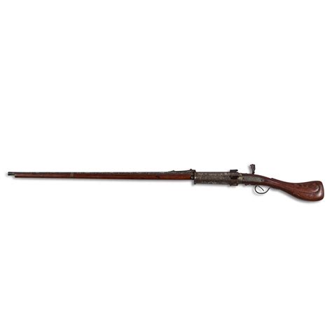 A rare six-barrelled silver damascened matchlock revolving gun, Early ...