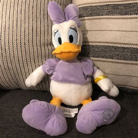 Disney Store Daisy Duck Plush on Mercari | Disney stuffed animals ...